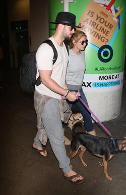 Ashley Greene and fiance take their dog on a plane