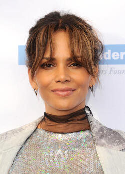 Pregnant at 50 Halle Berry cradles apparent baby bump at the Butterfly Ball