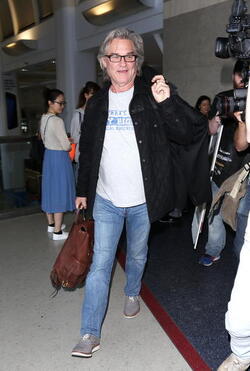 Goldie Hawn and Kurt Russell arrive at the airport