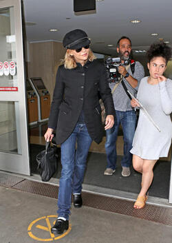 Meg Ryan Tries To Keep A Low Profile Arriving In L.A. After CFDA Awards