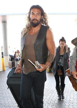Jason Momoa Clutches His Favorite Pillow Going Through LAX TSA