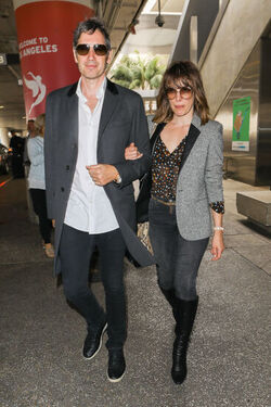 Milla Jovovich and husband director Paul W. S. Anderson were spotted returning to Los Angeles at LAX.
