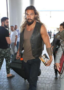 Jason Momoa Clutches His Favorite Pillow Going Through LAX TSA