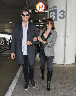 Milla Jovovich and husband director Paul W. S. Anderson were spotted returning to Los Angeles at LAX.
