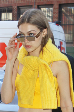Gigi Hadid wears an all yellow ensemble as she arrives at her apartment