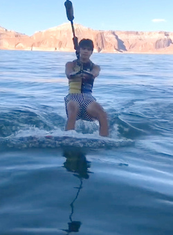 HIGH SCHOOL GRADUATE TAKES UNIQUE GRADUATION PHOTOS WHILE WAKESURFING