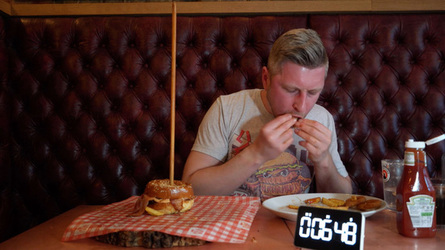 Foodie Smashes Record For Huge Burger Tower Challenge Foodie Smashes Record For Huge Burger Tower Challenge