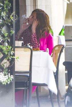 Trinny Woodall smokes outside at Scotts