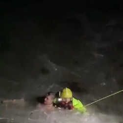 VIDEO Foolish man who went for night time swim in treacherous sea is saved by hero firefighters who dived in after him