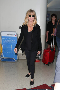 Goldie Hawn and Kurt Russell arrive at the airport