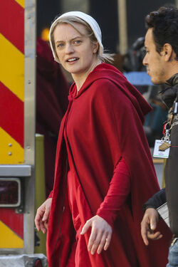 EXCLUSIVE Elisabeth Moss in Costume as Offred in The Handmaid s Tale Filming in Toronto.