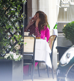 Trinny Woodall smokes outside at Scotts