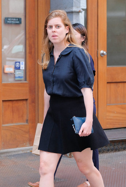 rincess Beatrice of York beats the heat in a short skirt as she walks in Soho