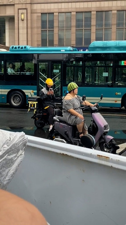 Woman Riding Scooter Uses Half Watermelon For Helmet