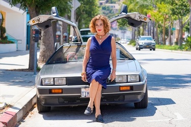 Claudia Wells Poses for Pictures Next to a Delorean