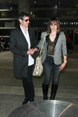 Milla Jovovich and Paul Anderson pictured at Los Angeles International Airport Milla Jovovich and Paul Anderson pictured at Los Angeles International Airport