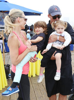 Molly Sims rides a stationary bike for charity
