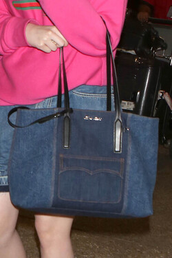 Elle Fanning so pretty in pink Gucci shirt at LAX