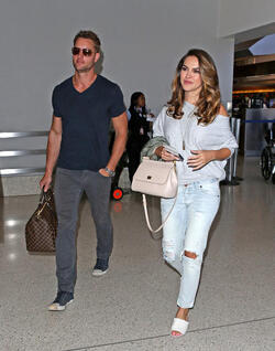 Justin Hartley And Fiance Chrishell Stause Head Out Of LAX On Romantic Holiday