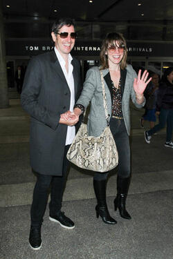 Milla Jovovich and Paul Anderson pictured at Los Angeles International Airport Milla Jovovich and Paul Anderson pictured at Los Angeles International Airport