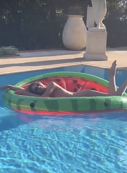 Liz Hurley poses totally nude on a slice of watermelon Liz Hurley poses totally nude on a slice of watermelon