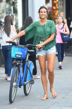 Kelly Bensimon pushing her Citi Biki and going for lunch in short shorts