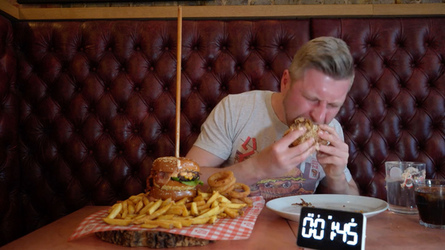 Foodie Smashes Record For Huge Burger Tower Challenge Foodie Smashes Record For Huge Burger Tower Challenge
