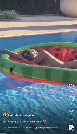 Liz Hurley poses totally nude on a slice of watermelon Liz Hurley poses totally nude on a slice of watermelon