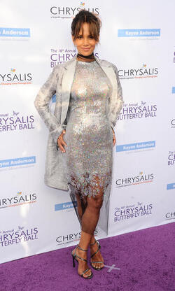 Pregnant at 50 Halle Berry cradles apparent baby bump at the Butterfly Ball
