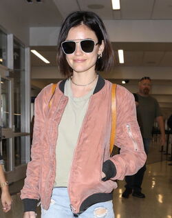Pretty Little Liars star Lucy Hale looks cute in a rose colored silk bomber light green tee ripped jeans and black tennis shoes as she touches down in L.A. after a long flight from NYC. Pretty Little Liars star Lucy Hale looks cute in a rose colored silk bomber light green tee ripped jeans and black tennis shoes as she touches down in L.A. after a long flight from NYC.