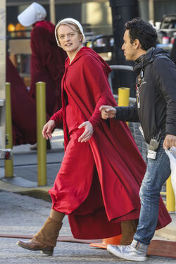 EXCLUSIVE Elisabeth Moss in Costume as Offred in The Handmaid s Tale Filming in Toronto.