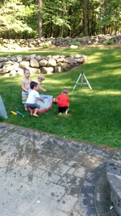 KID THROWS WATER BALLOON KID THROWS WATER BALLOON