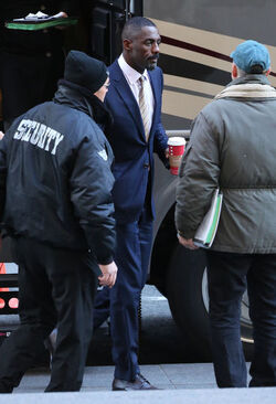 Idris Elba wears a Navy Blue Pinstriped Suit on set of Molly s Game in Toronto