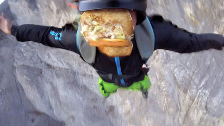 HAMBURGER AND FLIES HILARIOUS MOMENT BASE JUMPER OFF OFF THE SIDE OF A CLIFF WHILE EATING HIS LUNCH with video 