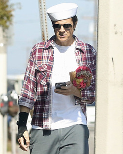 Johnny Knoxville Accesorizes with Sailor Hat and Wrist Brace