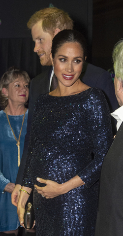 Meghan Markle can t stop cradling her bumpt at the Cirque du Soleil premiere