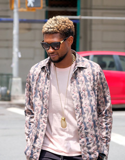 Usher wears comical slippers as he walks in Tribeca