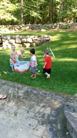KID THROWS WATER BALLOON KID THROWS WATER BALLOON