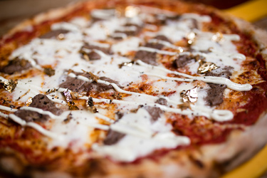 A LOT OF CHEDDAR NEW 2 500 CALORIE PIZZA IS TOPPED WITH 24K GOLD