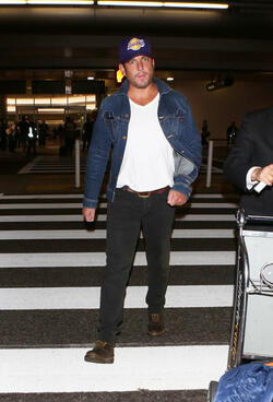 Comedic actor Will Arnett arrives at LAX sporting a cool denim jacket facial scruff and a Lakers cap as he makes his way to his vehicle. Comedic actor Will Arnett arrives at LAX sporting a cool denim jacket facial scruff and a Lakers cap as he makes his way to his vehicle.
