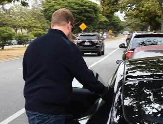 James Corden was spotted in Brentwood climbing into his Aston Martin Rapide sportscar.