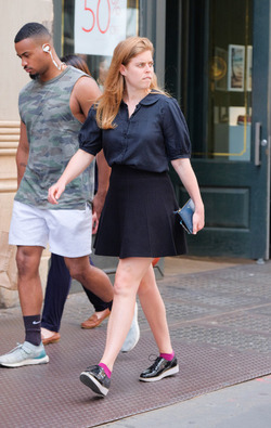 rincess Beatrice of York beats the heat in a short skirt as she walks in Soho