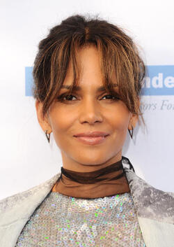 Pregnant at 50 Halle Berry cradles apparent baby bump at the Butterfly Ball
