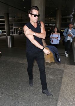 Colin Farrell was spotted in a sleeveless t shirt at LAX