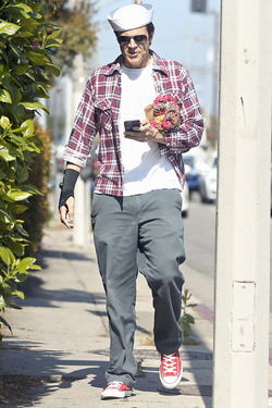 Johnny Knoxville Accesorizes with Sailor Hat and Wrist Brace