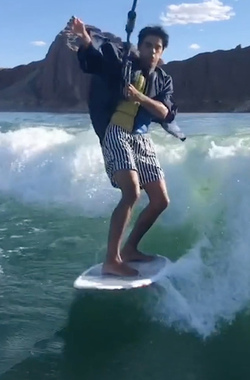 HIGH SCHOOL GRADUATE TAKES UNIQUE GRADUATION PHOTOS WHILE WAKESURFING