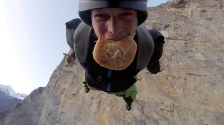 HAMBURGER AND FLIES HILARIOUS MOMENT BASE JUMPER OFF OFF THE SIDE OF A CLIFF WHILE EATING HIS LUNCH with video 