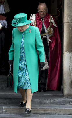 Queen Elizabeth II and Prince Philip Duke of Edinburgh attend a service to mark the 100th anniversary of the Order of the British Empire at St Paul s Cathedral in London.