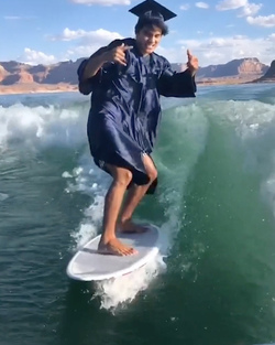 HIGH SCHOOL GRADUATE TAKES UNIQUE GRADUATION PHOTOS WHILE WAKESURFING