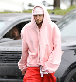 Disheveled Justin Bieber goes go karting in the rain
